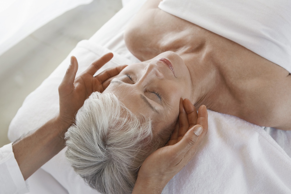 A senior woman getting a massage at the assisted living in Elkhorn